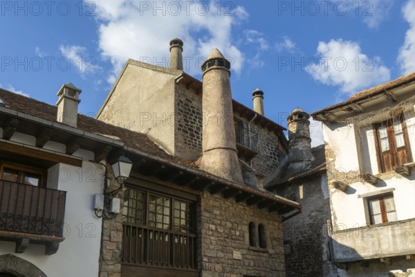 Traditional chimneys medieval village of Echo or Hecho, Valle de Hecho, Pyrenees Mountains, Huesca province, Aragon, Spain