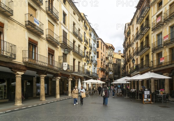 Historic buildings pedestrianised street Plaza Carlos Castel, leading off Plaza Torino, city centre square, Teruel, Aragon, Spain