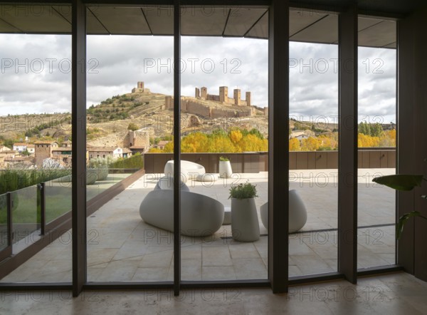 View of castle through glass windows of new Parador de Molina de Aragón, Guadalajara province, Castile-La Mancha, Spain