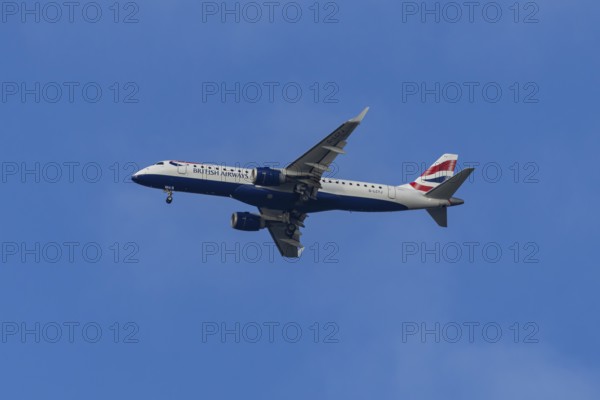 Embraer ERJ-190 jet passenger aircraft of British Airways BA CityFlyer airlines in flight on approach to London city airport, England, United Kingdom