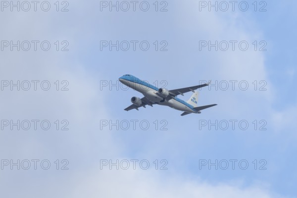 Embraer ERJ-190 jet passenger aircraft of Royal Dutch KLM cityhopper airlines in flight on approach to London city airport, England, United Kingdom