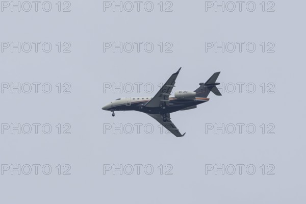 Embraer Legacy 500 executive business jet passenger aircraft of Flexair airlines in flight on approach to London city airport, England, United Kingdom