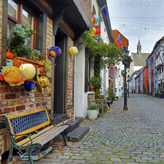 Tiefstraße decorated for Martin's procession with the tower of St. Peter's Church, Kempen, Lower Rhine, North Rhine-Westphalia, Germany