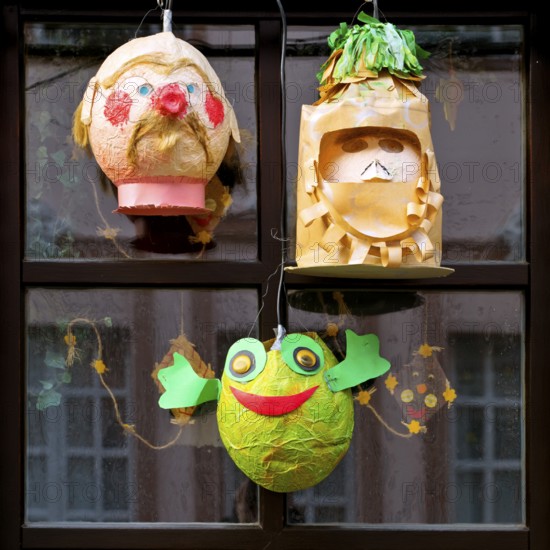 Homemade lanterns for the Martin train in front of a window, Old Town, Kempen, Lower Rhine, North Rhine-Westphalia, Germany