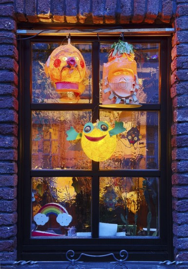 Homemade lanterns for the Martin procession in front of a window in the evening, Old Town, Kempen, Lower Rhine, North Rhine-Westphalia, Germany
