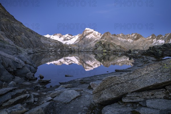 Mount Galenstock is reflected in Bergsee, Grätlisee, Canton of Valais, Switzerland