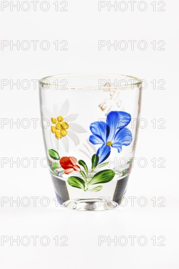 Shot glass with colorful floral decoration, gentian, edelweiss