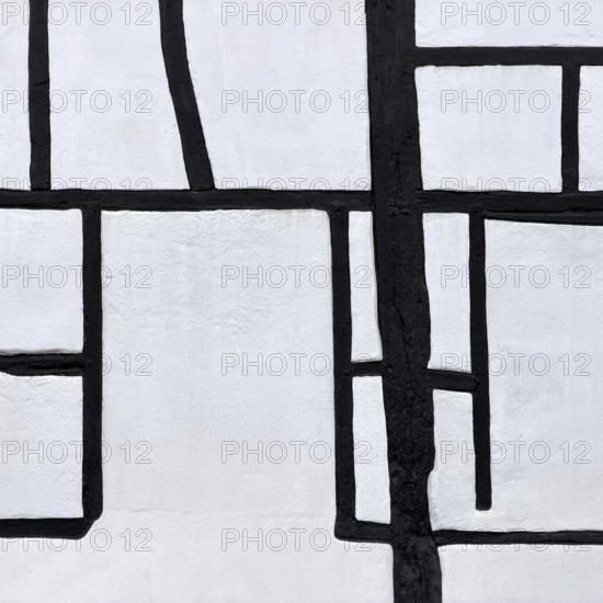 Unusual framework of irregularly arranged rectangular wooden beams in three compartments, semi-abstract detailed view, Kuhstraße 35, Kempen, North Rhine-Westphalia, Germany