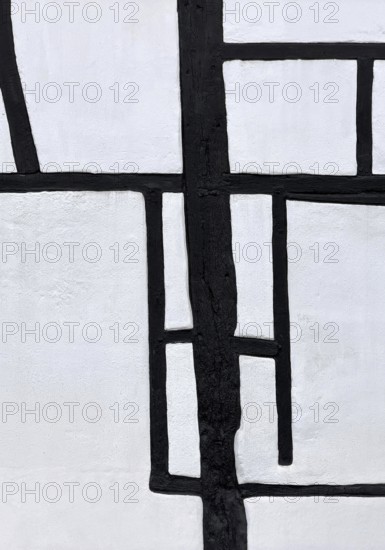 Unusual framework of irregularly arranged rectangular wooden beams in three compartments, semi-abstract detailed view, Kuhstraße 35, Kempen, North Rhine-Westphalia, Germany