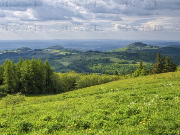 View from the summit of the Wasserkuppe over the hills of the Rhön to Milseburg, Gersfeld, Hesse, Germany