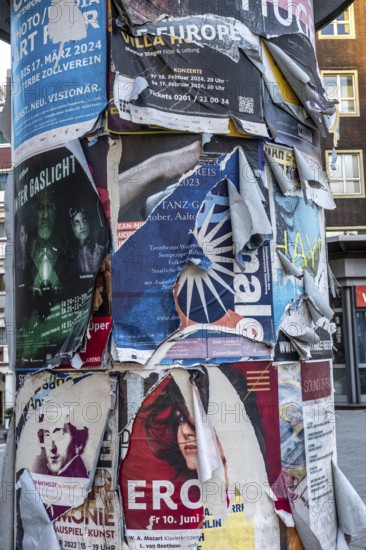Advertising column for cultural projects, advertising for events, unkempt, torn and exfoliated posters, Essen, North Rhine-Westphalia, Germany