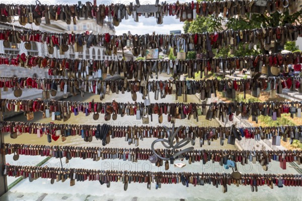 Love locks hang in several rows on the railing of the Mesarski Most (butcher's bridge) over the Ljubljanica in Ljubljana, Slovenia
