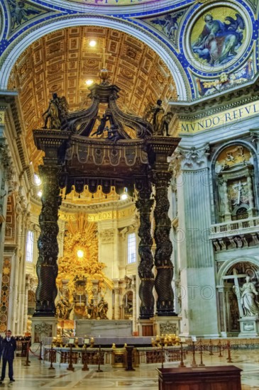 Canopy canopy ciborium by Gian Giovanni Lorenzo Bernini over Peter's tomb and papal altar in St. Peter's Basilica, in the background main apse of St. Peter's Basilica with stylized larger-than-life bronze throne reliquary for wooden chair decorated with ivory tablets Catheda Petri alleged chair of Simon Peter, Basilica of St. Peter, Vatican, Rome, Lazio, Italy