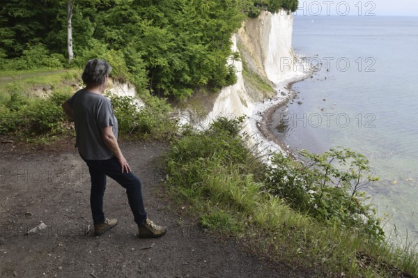 Woman hiking on the chalk coast on Rügen, Mecklenburg-Western Pomerania, Germany