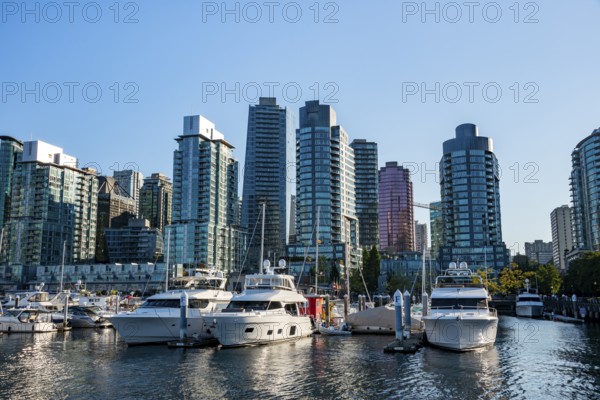 Sailing boats in marina, skyscrapers on the promenade, Coal Harbour, Vancouver, British Columbia, Canada