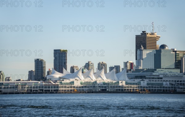 Skyline, skyscrapers and Canada Place on the promenade, Vancouver, British Columbia, Canada