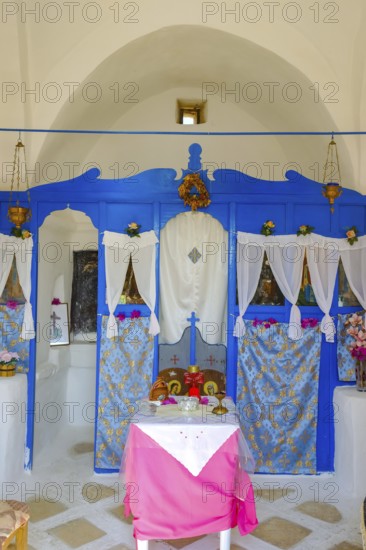 Ano Mera, Mykonos, Cyclades, Greece - Small church from the 18th century on the site of the Gyzi ruins, 13th century castle ruins by the Venetian Gyzi family, right next to the Paleokastro monastery in the interior of the island just outside Ano Mera, is now a tourist attraction much visited by tourists
