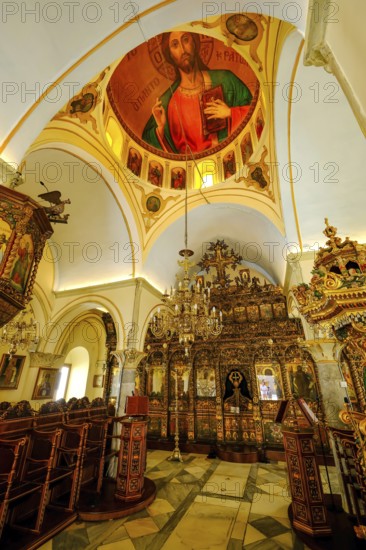 Ano Mera, Mykonos, Cyclades, Greece - The Panagia Tourliana monastery is the center of Ano Mera. Icons and lots of gold leaf inside the monastery. The men's convent from the 16th century on the village square in the interior of the island is now a tourist attraction much visited by tourists