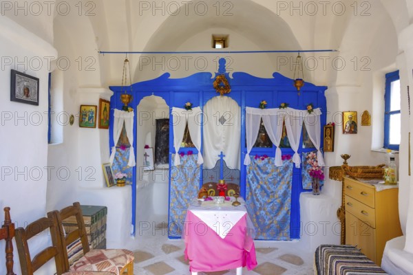 Ano Mera, Mykonos, Cyclades, Greece - Small church from the 18th century on the site of the Gyzi ruins, 13th century castle ruins by the Venetian Gyzi family, right next to the Paleokastro monastery in the interior of the island just outside Ano Mera, is now a tourist attraction much visited by tourists