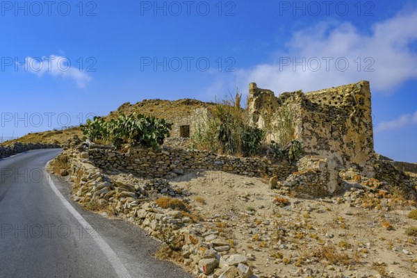 Ano Mera, Mykonos, Cyclades, Greece - Gyzi ruins, castle ruins from the 13th century by the Venetian Gyzi family, right next to the Paleokastro monastery in the interior of the island just outside Ano Mera, is now a tourist attraction much visited by tourists
