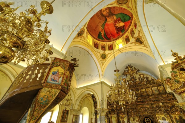 Ano Mera, Mykonos, Cyclades, Greece - The Panagia Tourliana monastery is the center of Ano Mera. Icons and lots of gold leaf inside the monastery. The men's convent from the 16th century on the village square in the interior of the island is now a tourist attraction much visited by tourists