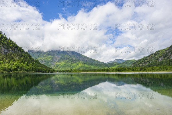 Landscape of Lake Offensee after rain when the sun comes through the clouds in spring, Salzkammergut, Austria