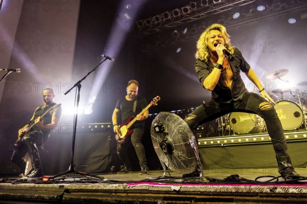 Ande Braun (guitarist), Steffen Haile (bassist) and Hannes Braun (singer) of the band Kissin' Dynamite live on Back with a Bang World Tour at Capitol Hannover on 09.11.2025