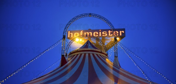 Circus, circus tent, logo behind furniture store Hofmeister, blue hour, Sindelfingen, Baden-Württemberg, Germany