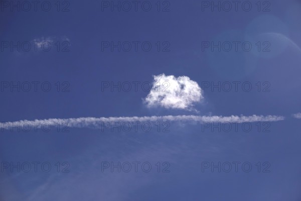 Cloudy sky with contrails, Germany