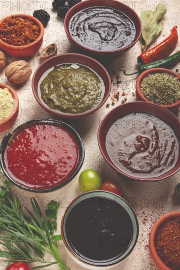 Assortment of Georgian sauces and spices, top view, set of spices and tkemali, Georgian, food background
