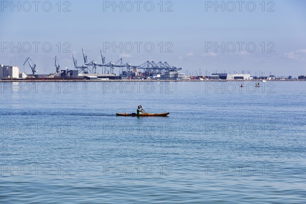 Kayaker, view of port facilities, container port, Aarhus, Jutland, Denmark