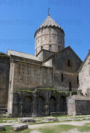 Monumental monastery complex with characteristic tower and stone architecture under a blue sky, main church Surb Pogos-Petros, Tatev monastery, Armenian Apostolic monastery, Syunik province, Caucasus, Armenia