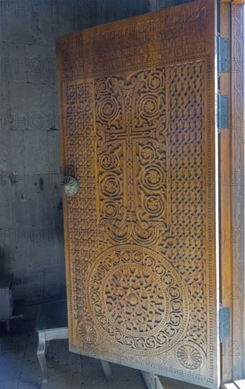 Detailed wooden door with cross engraving and ornaments, Tatev monastery, Tatev, Armenian Apostolic Monastery, Syunik province, Syunik, Caucasus, Armenia