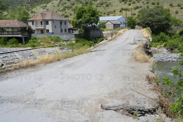 A dilapidated bridge crosses a river in a small rural village, bridge over the Debed River, Ayrum, Tavush province, Tavush, Armenia