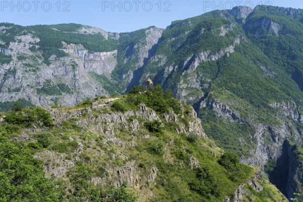 Small rotunda on a green mountainside with majestic rock formations, Halidzor observation deck, Syunik province, Syunik, Armenia
