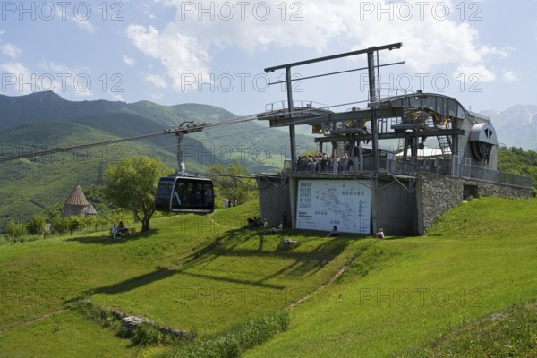 Cable car station on a green hill with views of the surrounding mountain landscapes, Tatev cable car, Wings of Tatev, Tatev wing, cable car station in Tatev with Tatev monastery, Syunik province, Caucasus, Armenia