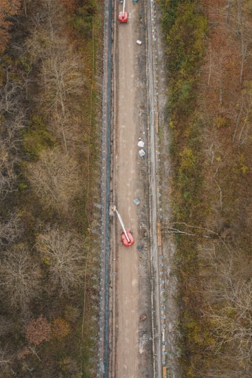 Aerial view of a construction site in the forest with machinery and lift on a slope, construction of the Hermann Hesse Railway, Im Hau, Calw, Germany