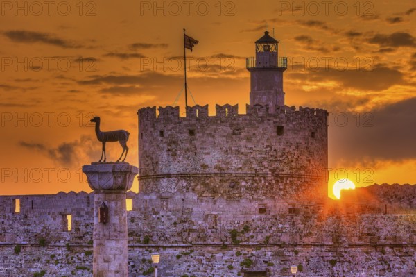 Agios Nikolaos fortress, castle and statue at sunrise with emotional and peaceful atmosphere, UNESCO World Heritage Site, Old Town of Rhodes Town, Rhodes, Dodecanese, Greece