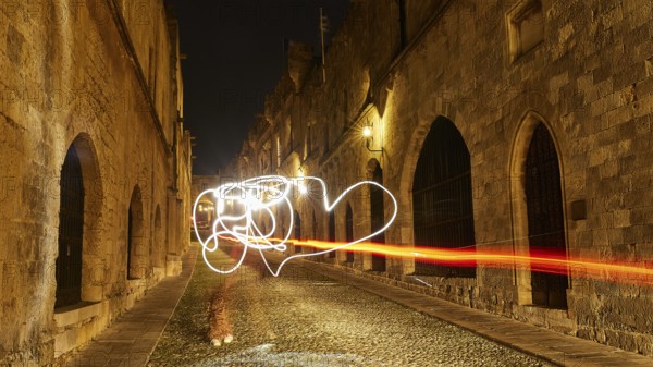 Knight's Town, night view of an old town alley with light paintings and historic buildings, UNESCO World Heritage Site, Old Town of Rhodes Town, Rhodes, Dodecanese, Greece
