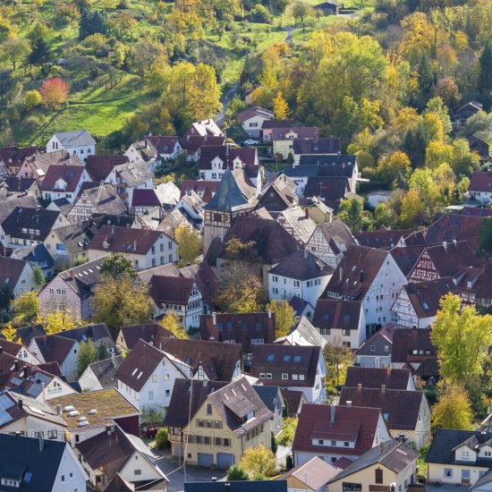 View of a picturesque village with red roofs and autumn trees, Strümpfelbach im Remstal, Baden-Württemberg, Germany