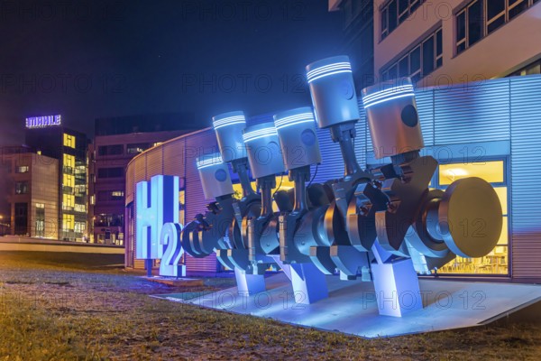 Automotive supplier Mahle. The piston shaft in front of the head office was supplemented by an H2 oil sculpture. It represents the company's expertise in the research and development of fuel cells. Stuttgart, Baden-Württemberg, Germany