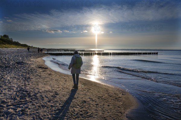 Walkers on the Baltic Sea beach, Ahrenshoop, Darß, Mecklenburg-Western Pomerania, Germany