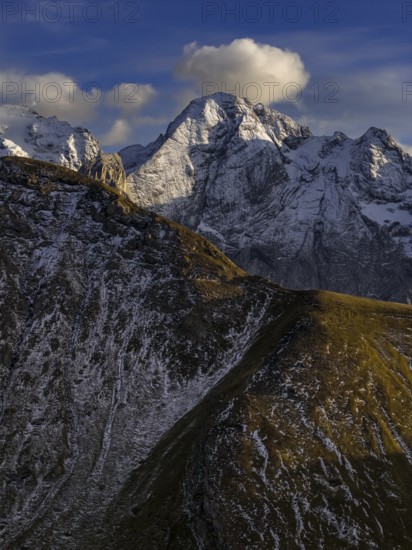 Steep mountains, snowy, mountain range, sunny, wild, autumn, aerial view, Pordoi Pass, view of Marmolada, Dolomites, Italy