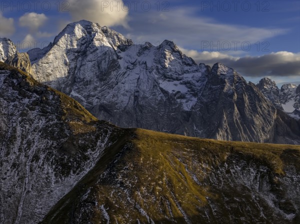 Steep mountains, snowy, mountain range, sunny, wild, autumn, aerial view, Pordoi Pass, view of Marmolada, Dolomites, Italy