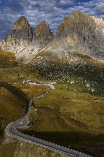 Mountain landscape, steep mountains, morning light, cloud atmosphere, autumn, Sella Pass, view of Lungkofel and Plattkofel, Dolomites, Italy