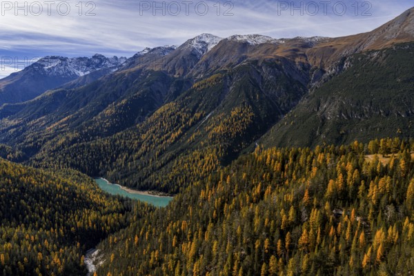 Mountain landscape, wild, untouched, coniferous forest, sunny, riverbed, autumn, larch forest, reservoir, aerial view, Val Müstair, Swiss National Park, Switzerland