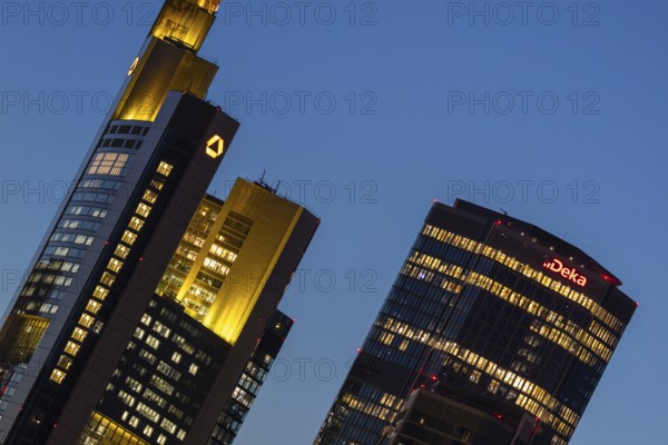 The towers of Commerzbank and Deka Bank in Frankfurt am Main light up in the evening, Frankfurt am Main, Hesse, Germany