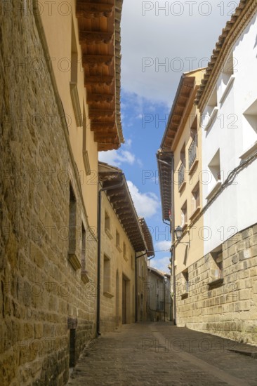 Narrow road alleyway street in medieval village of Uncastillo, Cinco Villas, Zaragoza province, Aragon, Spain