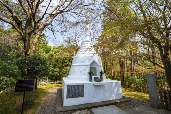 Small white pagoda, memorial for fallen soldiers in Burma during World War II, Ryoan-ji, Zen Buddhist temple complex, in spring, Kyoto, Japan