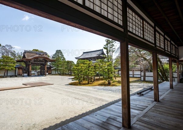 View from the veranda of a Kare-san-sui rock garden, Nantei Zen Garden, South Garden with Chokushi-mon Gate, Ninna-ji Goths, Buddhist temple complex, Kyoto, Japan